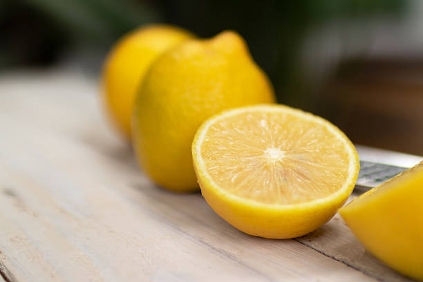 istock Fresh lemons on a wooden table. 2216788027