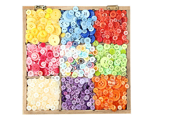 Colorful sewing buttons in basket on white background