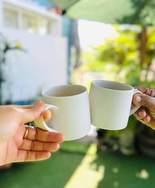 istock Clinking cups of coffee 2216788900