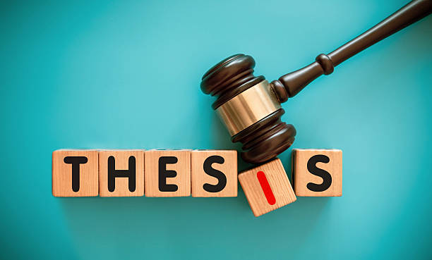 istock Gavel and wood block with THESIS 2216788965