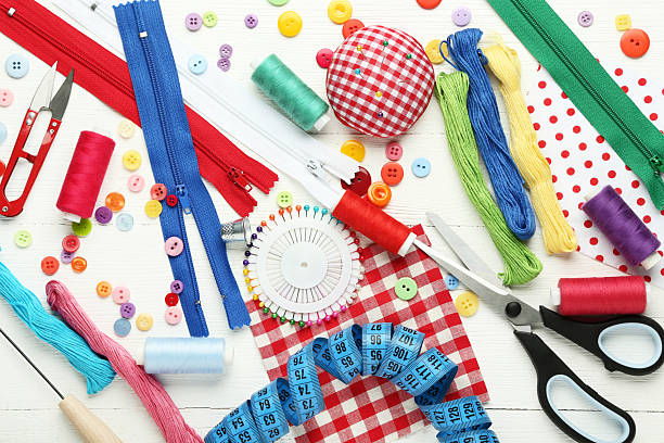 istock Sewing accessories on white wooden table 2216789141