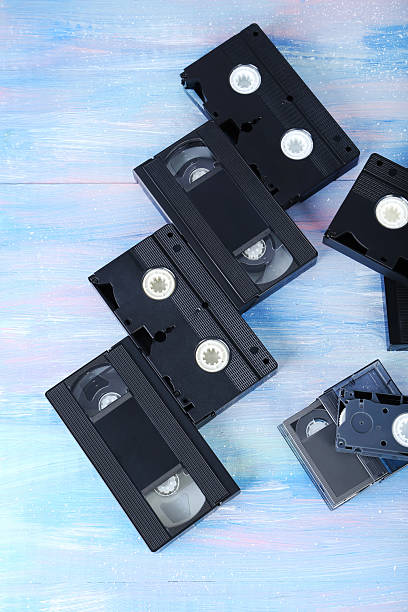 istock Video cassette tapes on wooden table 2216789301