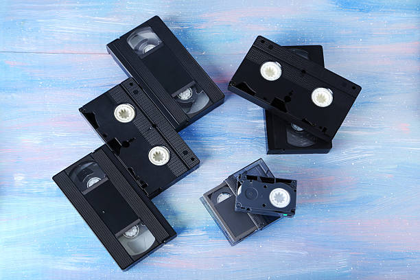 istock Video cassette tapes on wooden table 2216789413