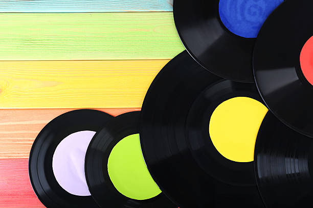 istock Vinyl records on colourful wooden table 2216789862