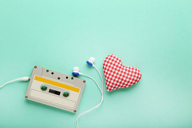 istock White cassette tape with earphones on mint background 2216790007