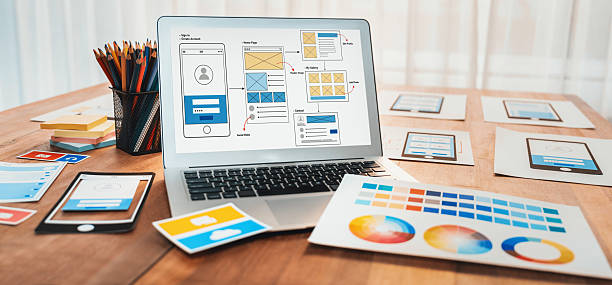 istock Digital wireframe design for web or mobile app UI on laptop. Scrutinize 2216790717
