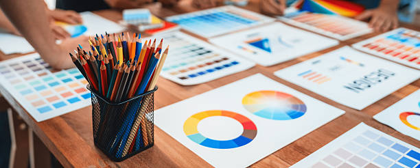 istock Graphic designer brainstorming logo and graphic arts at workshop. Scrutinize 2216790783