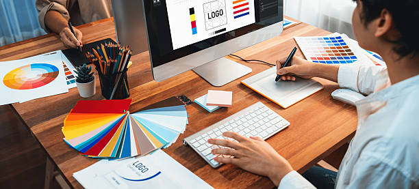 istock Graphic designer works on computer laptop with digital pen. Scrutinize 2216791330
