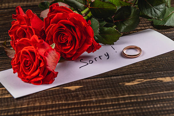 istock Broken engagement with roses and a heartfelt apology letter 2216791776