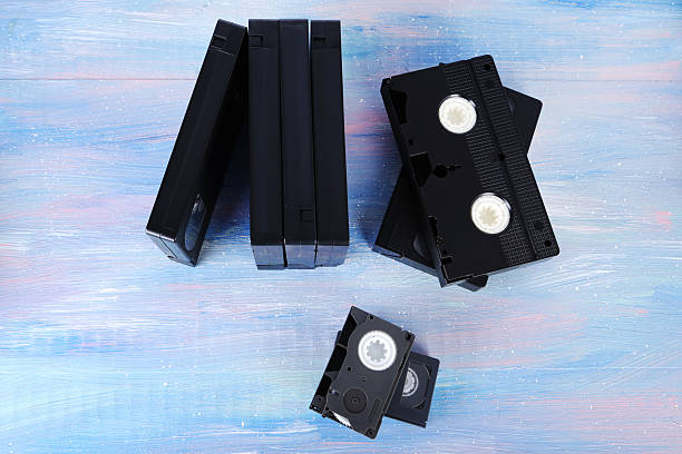 istock Video cassette tapes on wooden table 2216792892
