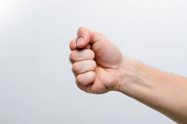 istock Clenched fist on a plain background 2216795696