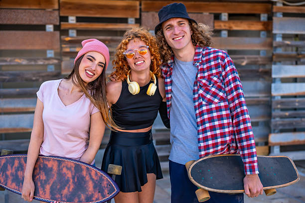 istock Young skaters smiling and posing together outdoors 2216797596