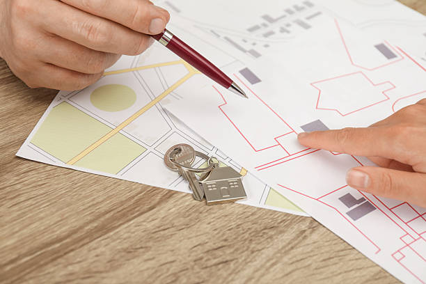 istock Real estate agent working with client at wooden table, closeup 2216798504