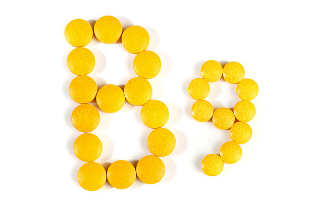 istock Vitamin B Pills isolated - B9 on white background 2216798620