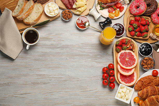 istock Different tasty food served for brunch on wooden table, flat lay. Space for text 2216798631