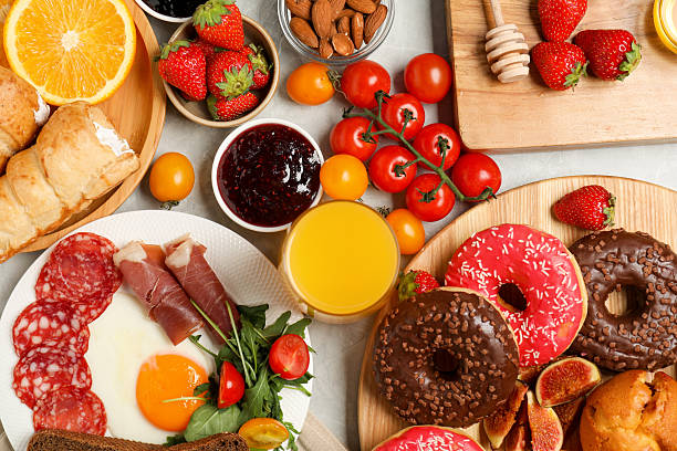 istock Different tasty food served for brunch on grey marble table, flat lay 2216798661