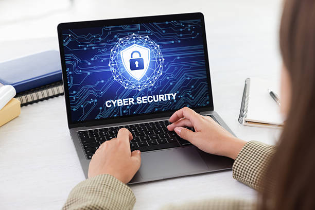 istock Cyber security. Woman using laptop at table, closeup 2216798703