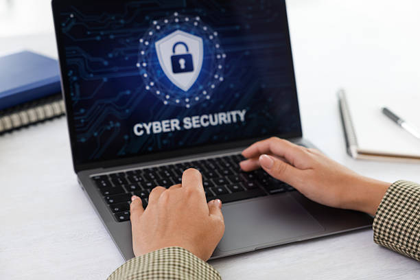 istock Cyber security. Woman using laptop at table, closeup 2216798733