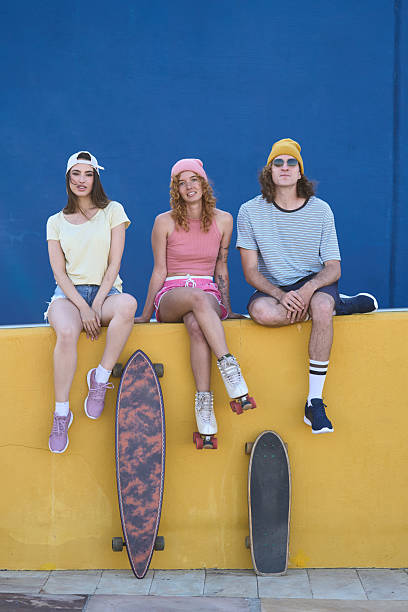 istock Group of young adults posing with skateboards and roller skates 2216800372