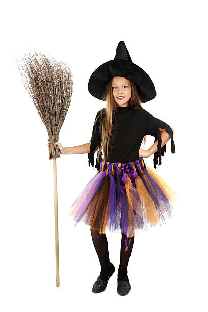 istock Beautiful girl witch with a broom on a white background 2216803698