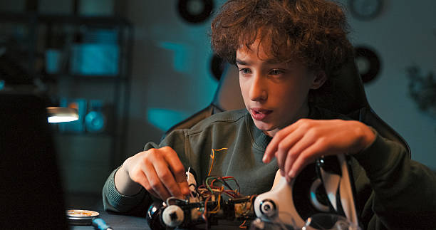 istock While working on a robotics project, the boy applies problem-solving and fine motor skills. He learns how to tinker and use tools through active construction. 2216804185