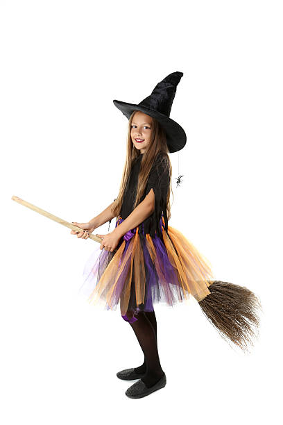 istock Beautiful girl witch with a broom on a white background 2216804434