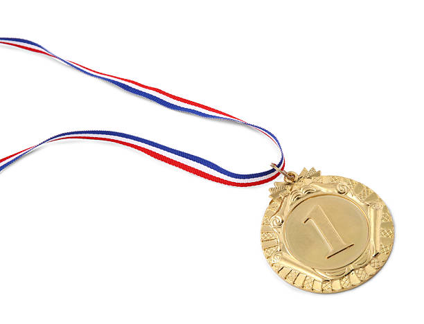 istock Golden medal with striped ribbon isolated on white 2216804513