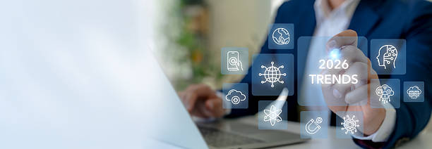 istock 2026 trends concept. A business professional interacts with virtual icons; key technological trends projected for 2026, including AI, sustainability, digital transformation, digital skill and health. 2216805996