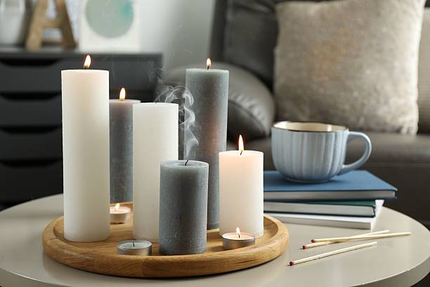 istock Beautiful burning candles and matches on light table indoors 2216806672