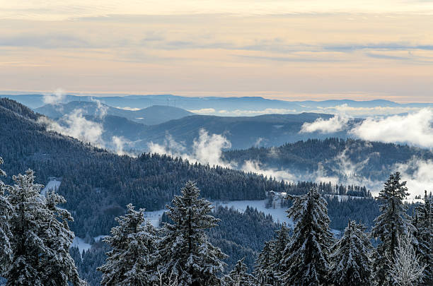 Snowy Mountain Landscape with Clouds and fog.
