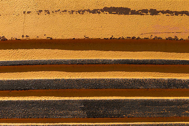 A stylized and layered yellow and black texture that beautifully showcases an artistic and modern wall design aesthetic