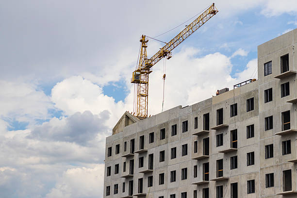 istock Industrial crane next to the building under construction. Development 2216812626