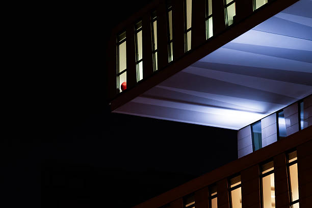istock Modern Architecture at Night with Red Balloon in Window 2216817072