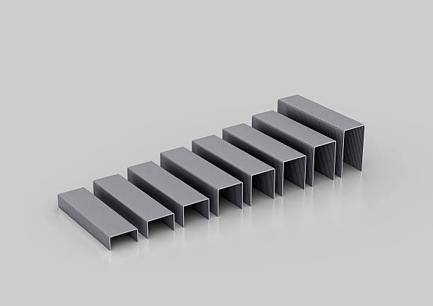istock A Series Of Silver Metal Staple Pins Arranged In Parallel Rows On White Background 3D Illustration 2216820028