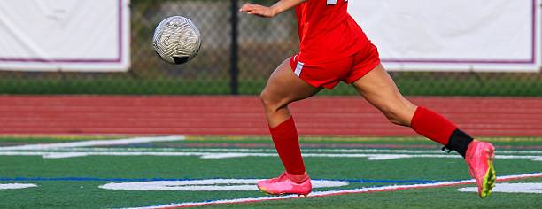 Soccer Player Makes a Swift Move on the Field During a Match
