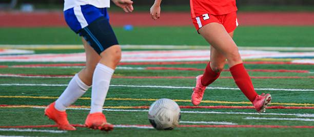 istock Young Athletes Playing Soccer During a Match on a Turf Field 2216820872