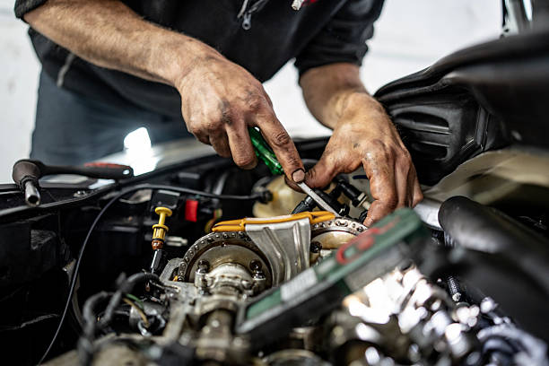 istock Mechanic Repairing a Vehicle Engine with Precision in a Workshop Setting 2216822683