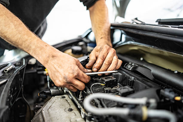 istock Close-Up of Mechanic Repairing Car Engine in Workshop Setting 2216822810