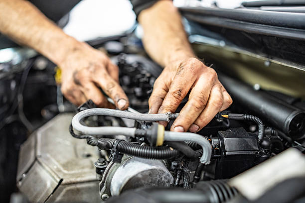 istock Hands Repairing a Car Engine With Focus on Components and Cables 2216822811