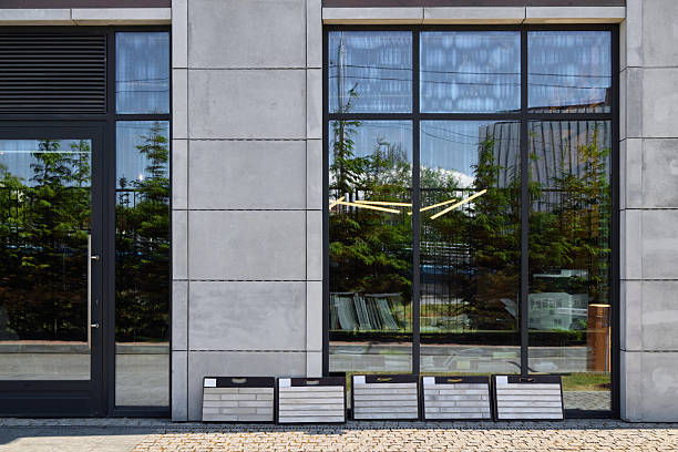 istock A modern building facade with reflective windows and display boards, an impressive landmark 2216824053