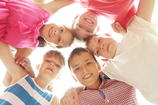 istock Happy childrens standing in the circle 2216826359