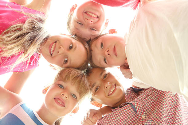 istock Happy childrens standing in the circle 2216826387