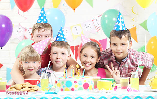 istock Happy childrens having fun at birthday party 2216827191
