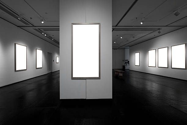 istock Blank picture frames with lighting on the walls inside the art exhibition hall 2216827410