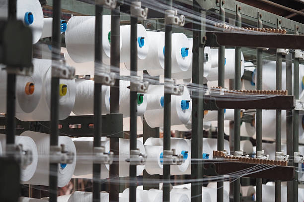 istock Textile manufacturing process in action at a factory facility 2216827702