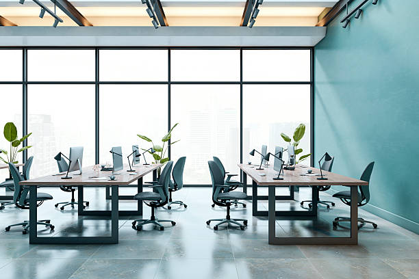 istock Modern open-plan business office interior with clean desks, ergonomic chairs, and large windows in a contemporary building. 3D Rendering 2216829287
