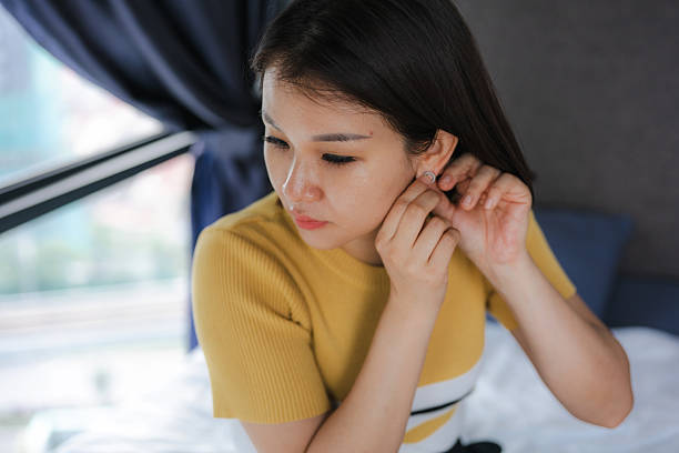 istock Women wearing earrings while dressing up for work 2216831691