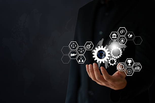 istock The Business man use hand to hold digital and techology icon floating on screen 2216835417