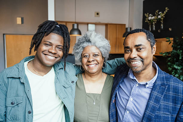 istock Real black family at home, smiling and looking at camera 2216837091