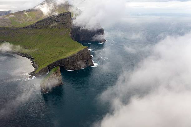 istock Aerial view of misty Faroe Islands cliffs 2216837742